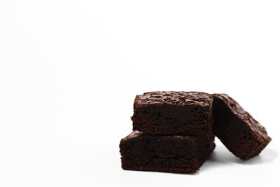 Close-up of chocolate cake against white background