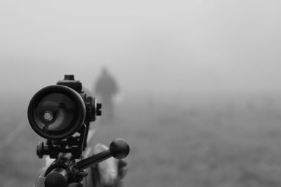 Close-up of camera during foggy weather