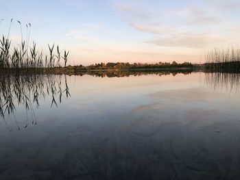 Scenic view of lake against sky during sunset