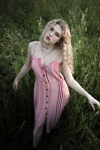 Portrait of woman wearing hat on field