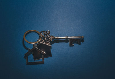 Close-up of key against blue background