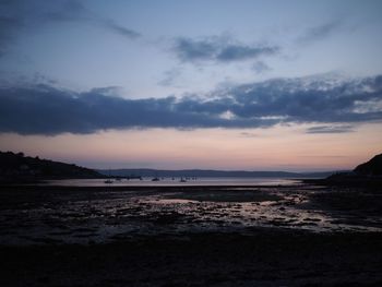 Scenic view of sea against sky at sunset