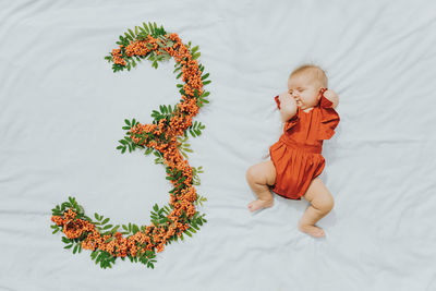 High angle view of cute baby on bed