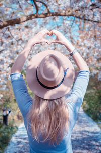 Rear view of woman wearing hat