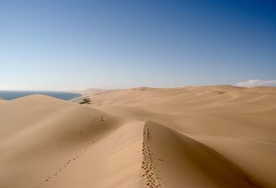 Scenic view of desert against clear sky