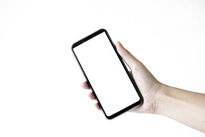 Low angle view of telephone pole against white background