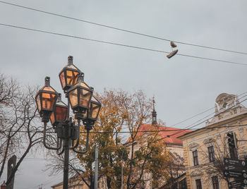 Low angle view of street light against sky