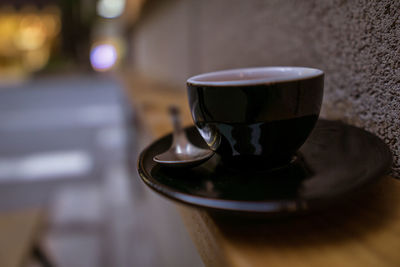 Close-up of coffee cup on table