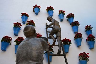 Rear view of people on flowers