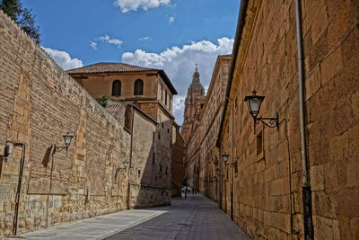 Street amidst buildings against sky