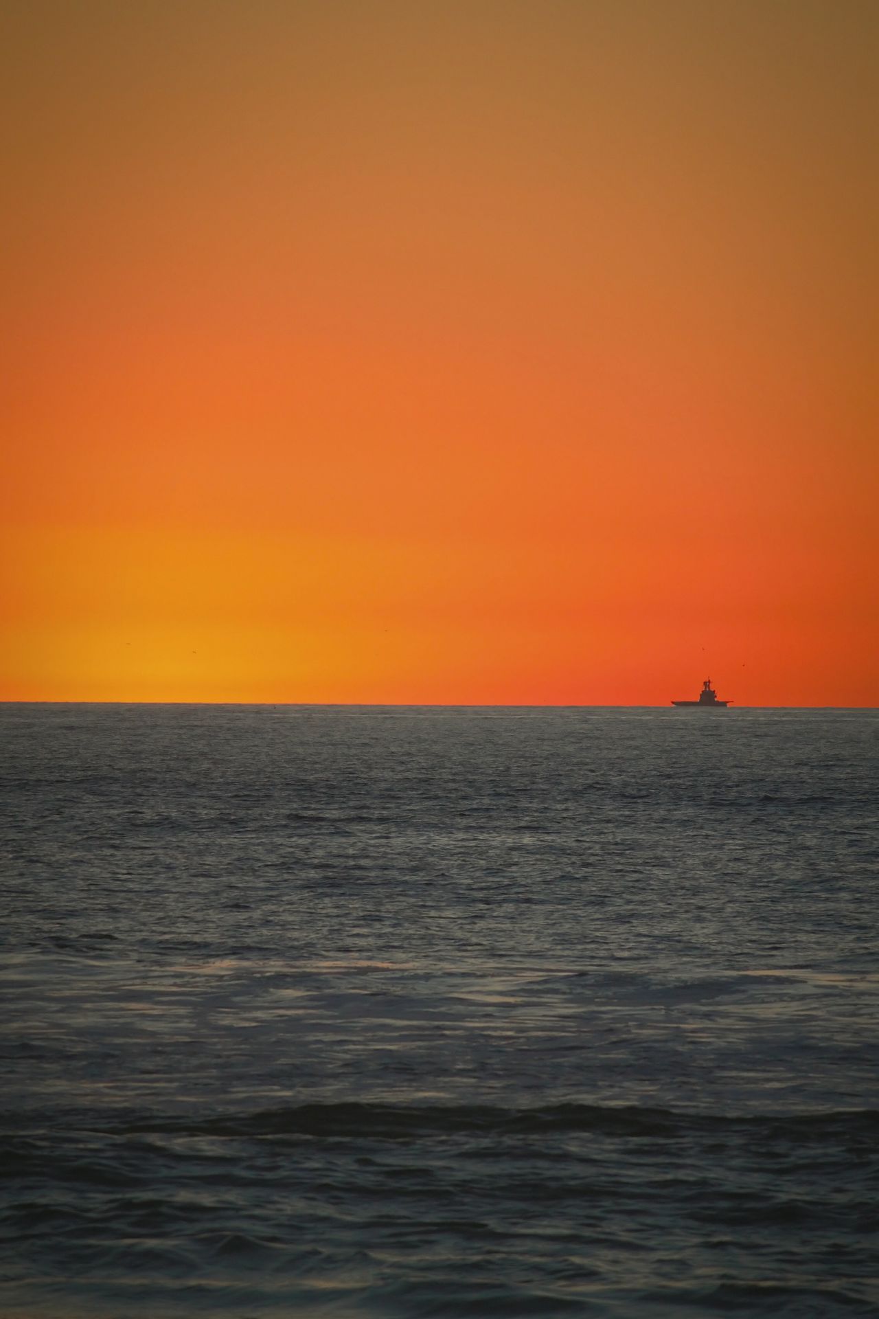 Vibrant sky over ocean