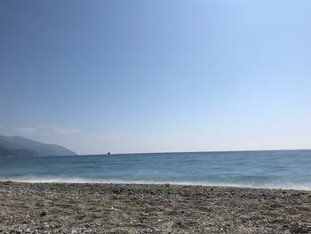 Scenic view of sea against clear blue sky