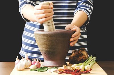 Close-up of woman preparing food