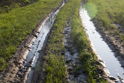 High angle view of canal amidst field