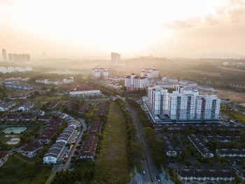 High angle view of cityscape against sky during sunset