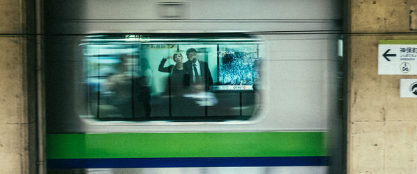 Blurred motion of train at railroad station