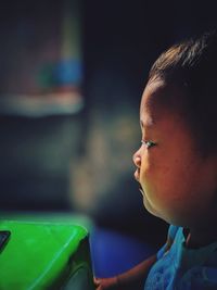 Close-up portrait of boy looking away