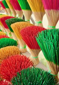 Close-up of multi colored incense sticks for sale