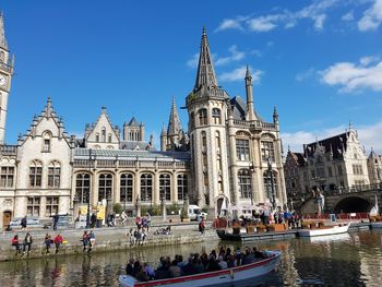 Canal by church in city