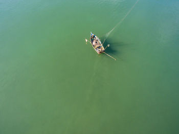 Directly above shot of man in boat sailing at sea