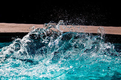 Close-up of waves splashing on water