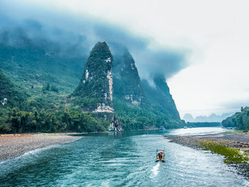 High angle view of boats sailing on river