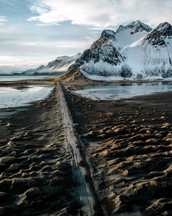 Scenic view of frozen lake against sky