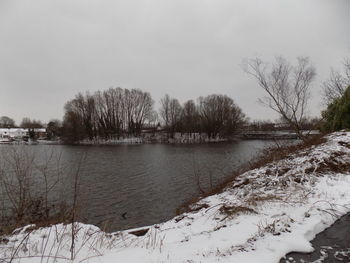 Scenic view of frozen lake against sky