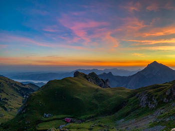 Scenic view of mountains against sky during sunset