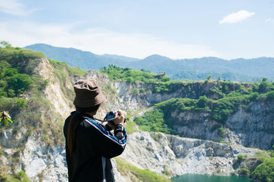 Rear view of woman looking at mountains