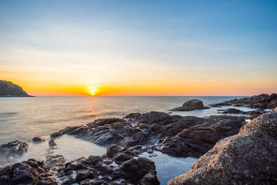 Scenic view of sea against sky during sunset