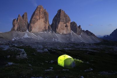 Scenic view of rocks and mountains against sky