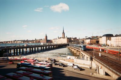High angle view of bridge over river by buildings in city