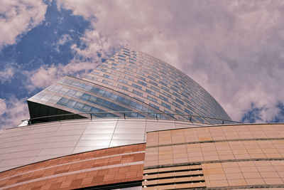 Low angle view of skyscraper against sky