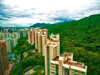 Houses against cloudy sky