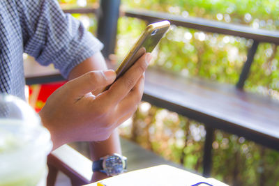Close-up of man using mobile phone