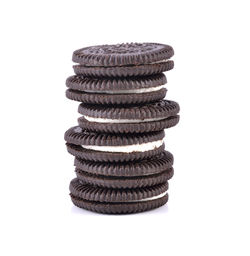 Close-up of stack of cookies against white background