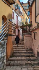 View of alley amidst buildings