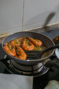 Close-up of meat in cooking pan