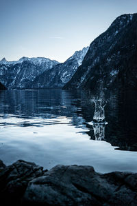 Scenic view of frozen lake against mountain