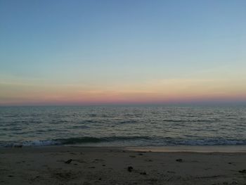 Scenic view of sea against clear sky during sunset