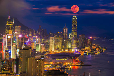 Illuminated modern buildings in city at night