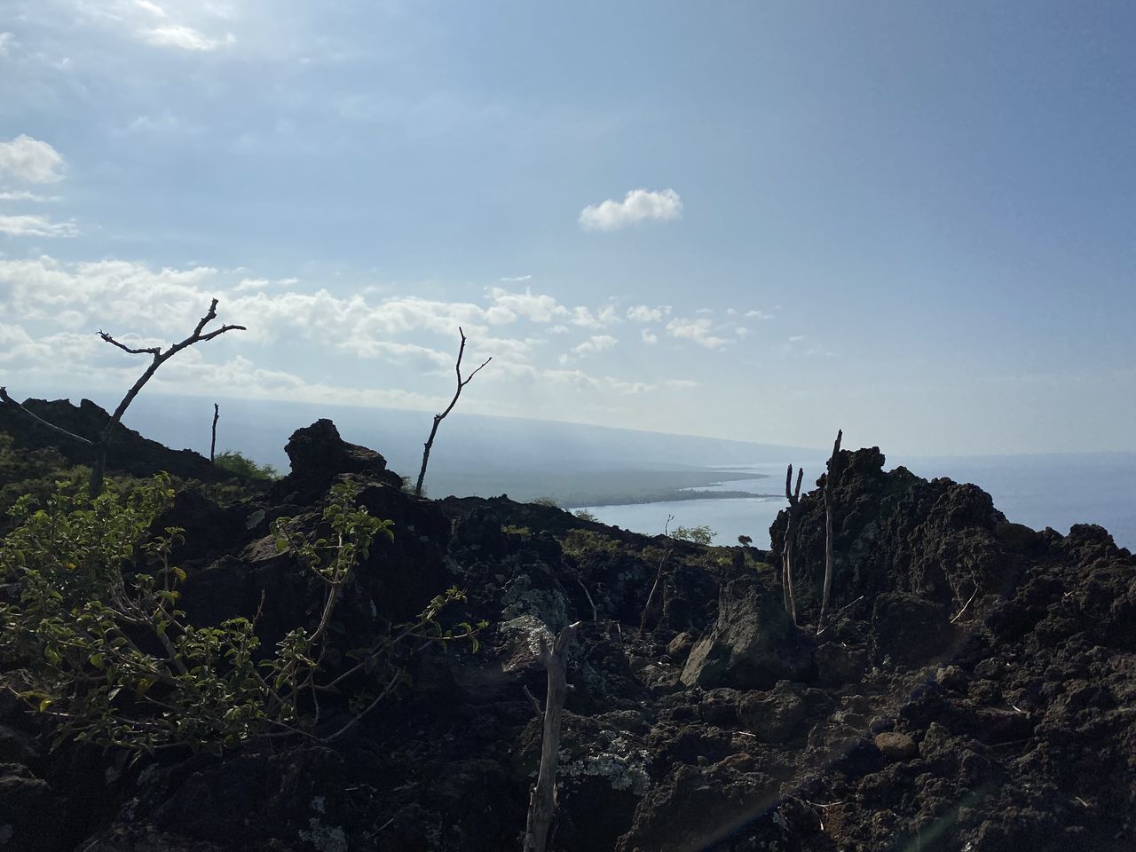 PANORAMIC VIEW OF ROCKS ON SHORE AGAINST SKY