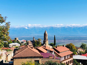 Panoramic view of buildings against blue sky