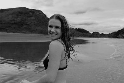 Portrait of young woman at beach