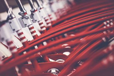 Row of red bicycles parked in rack