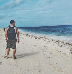 Woman standing on beach