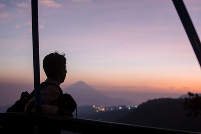 Portrait of silhouette man looking at sunset