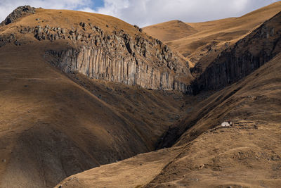 Scenic view of desert against mountain range