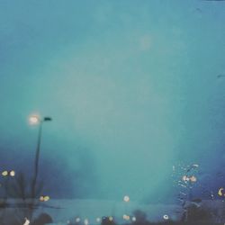 Illuminated street light at night